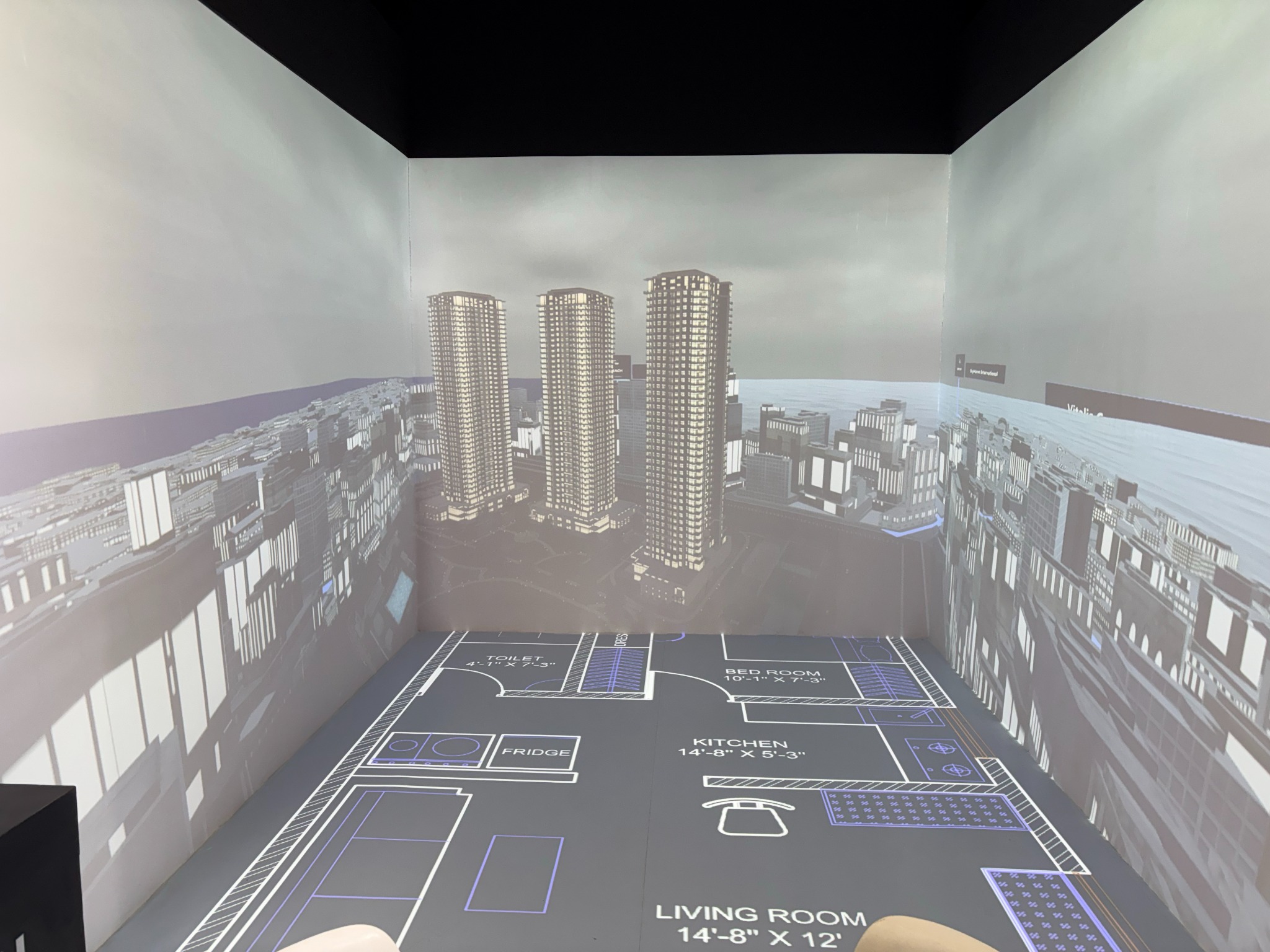 Architectural floor plan projected across the room.