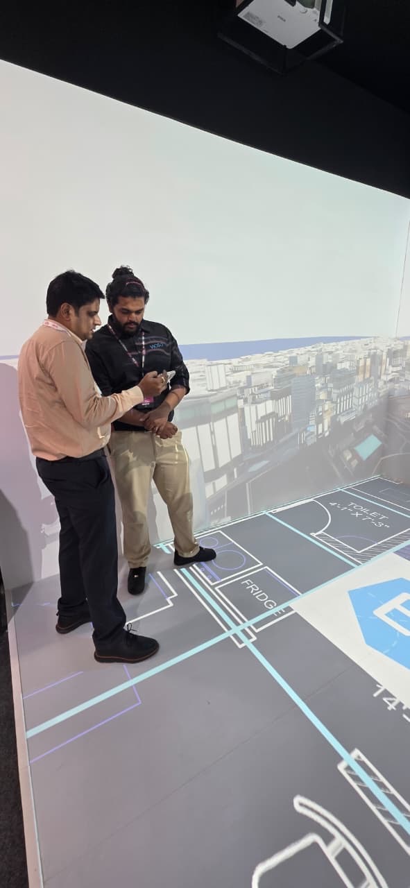 Discussing the architectural presentation inside the immersive room.
